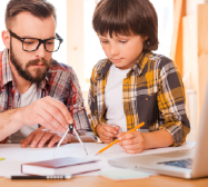 Dad and homeschooler working on advanced math