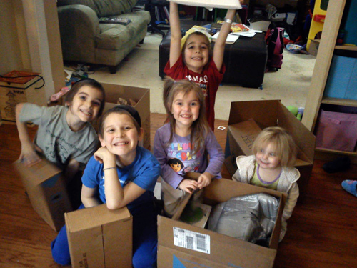 Students unboxing their Calvert homeschool curriculum