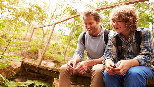 Father and son taking a break outdoors